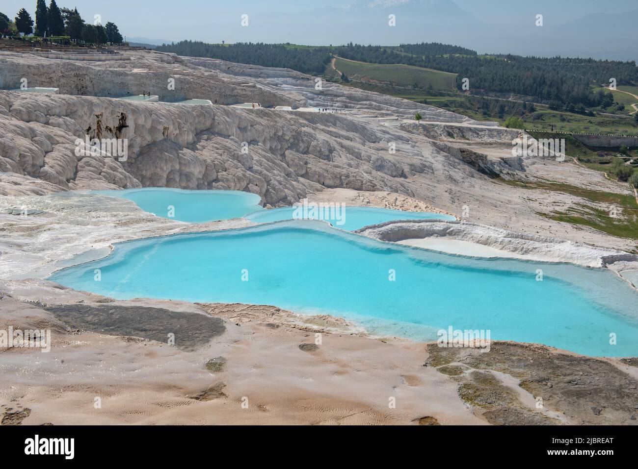 Stunning aqua blue pools of natural mineral rich spring water with many healing properties in beautiful Pamakkuae , the cotton castle of western Turke Stock Photo