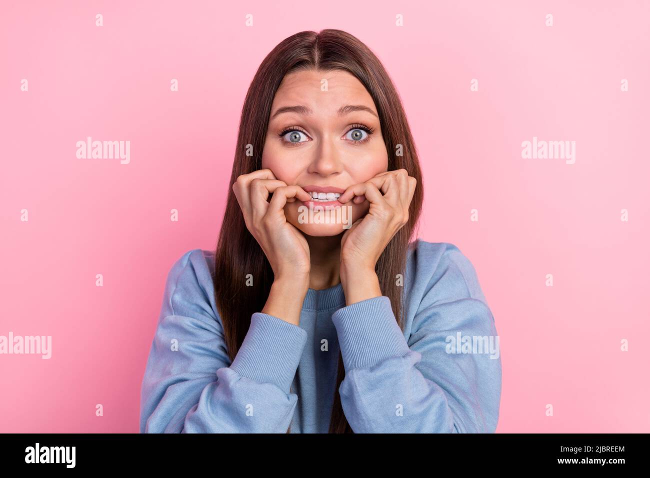 Portrait of attractive desperate frustrated girl biting nails oops ...