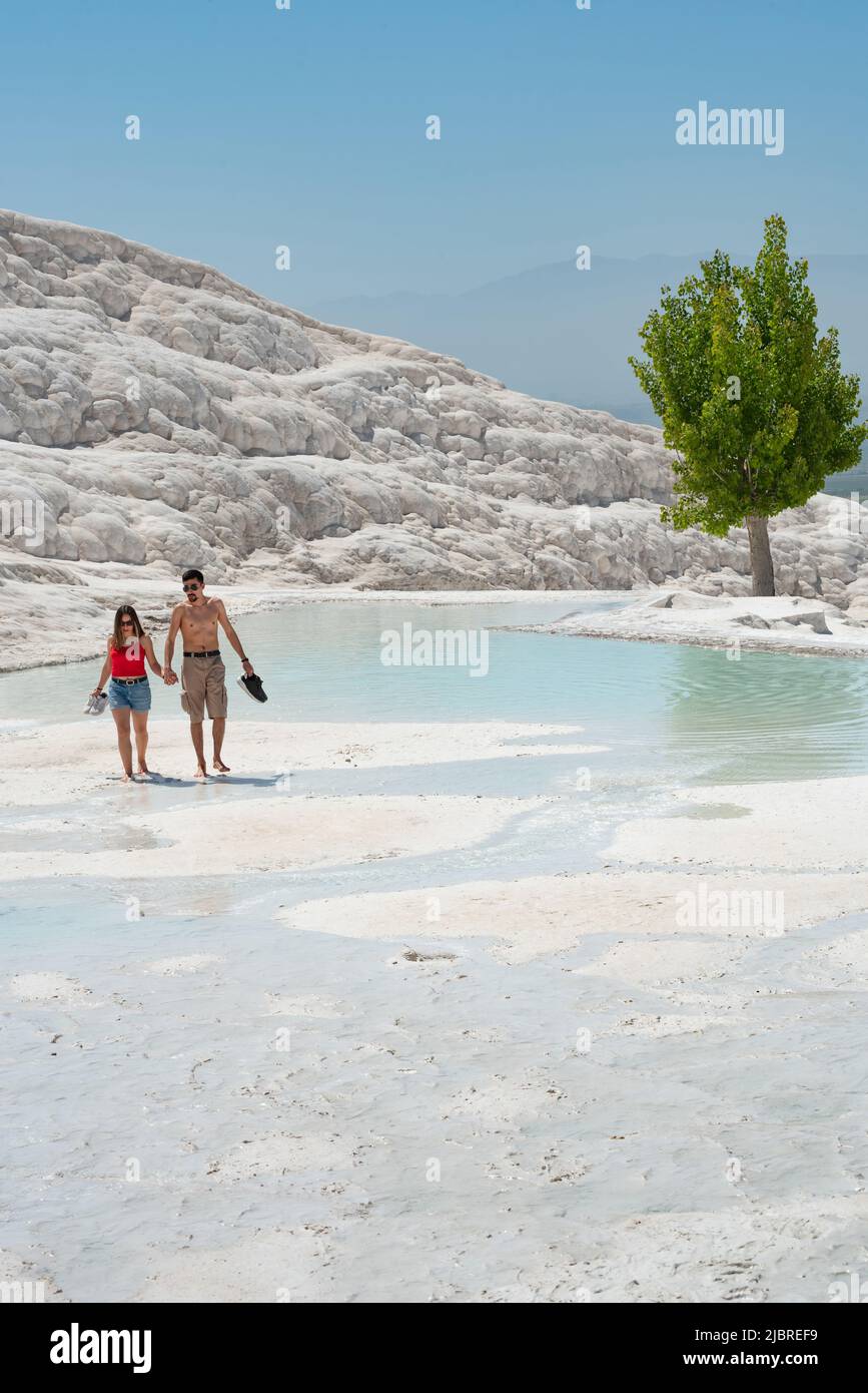 Pamakkule, Turkey, April 25th 2020 Tourists enter Travertine Terraces of Pamukkale the mineral rich thermal water has natural health giving properties Stock Photo