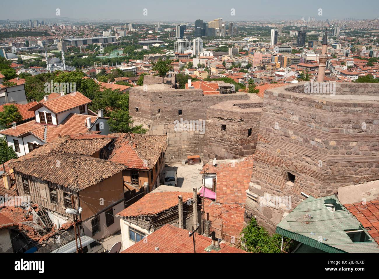 A panoramic view of old and modern houses from the ancient city walls of Ankara castle, Anatolia, Turkey.     Visitors to Ankara castle enjoy a panora Stock Photo