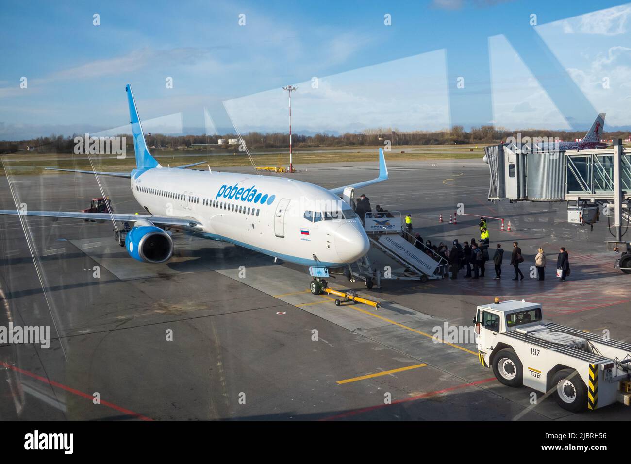 Plane on airfield against blue sky Stock Photo - Alamy