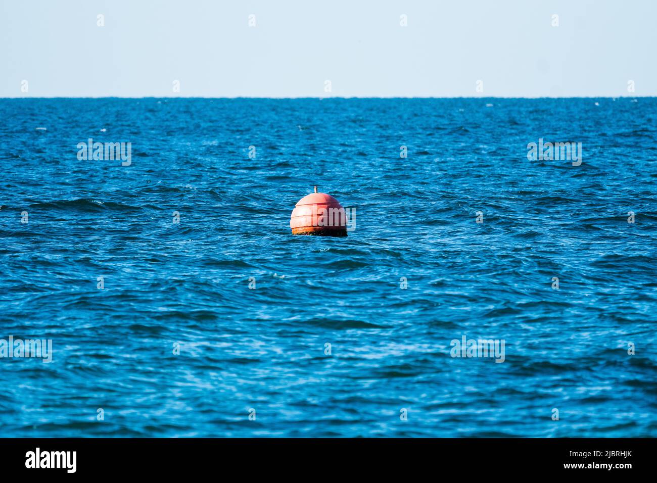 fishing buoy on the sea water or ocean concept fishing industry or recreational abstract background Stock Photo