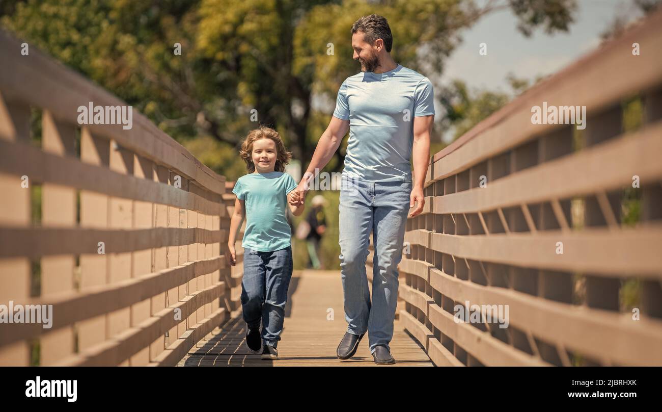 fathers day. cheerful father leading son outdoor. family value. childhood and parenthood. Stock Photo