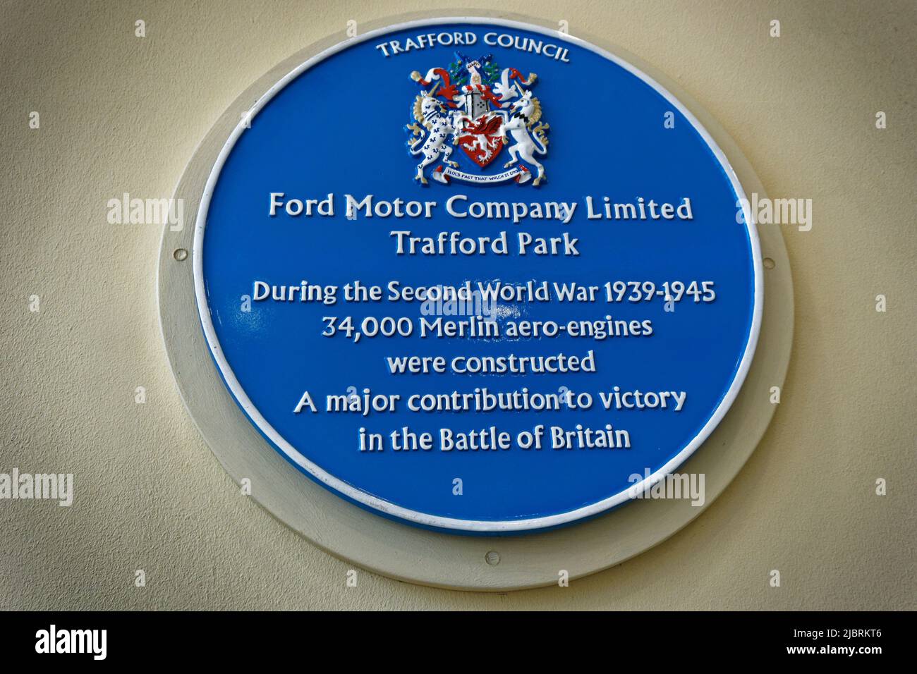 Blue Plate marking the site in Trafford where the Ford Motor Company made 34000 Merlin Aero engines under licence from Rolls Royce during World War 2. Stock Photo