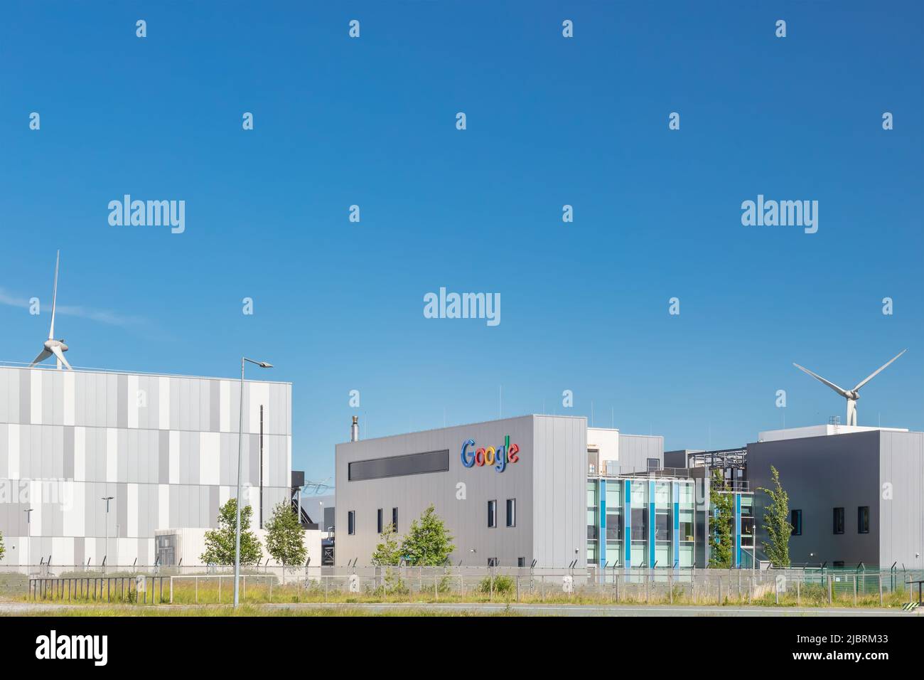 Eemshaven, The Netherlands - June 2, 2022: Entrance view of a Google data center in front of a clear blue sky in Eemshaven, The Netherlands Stock Photo