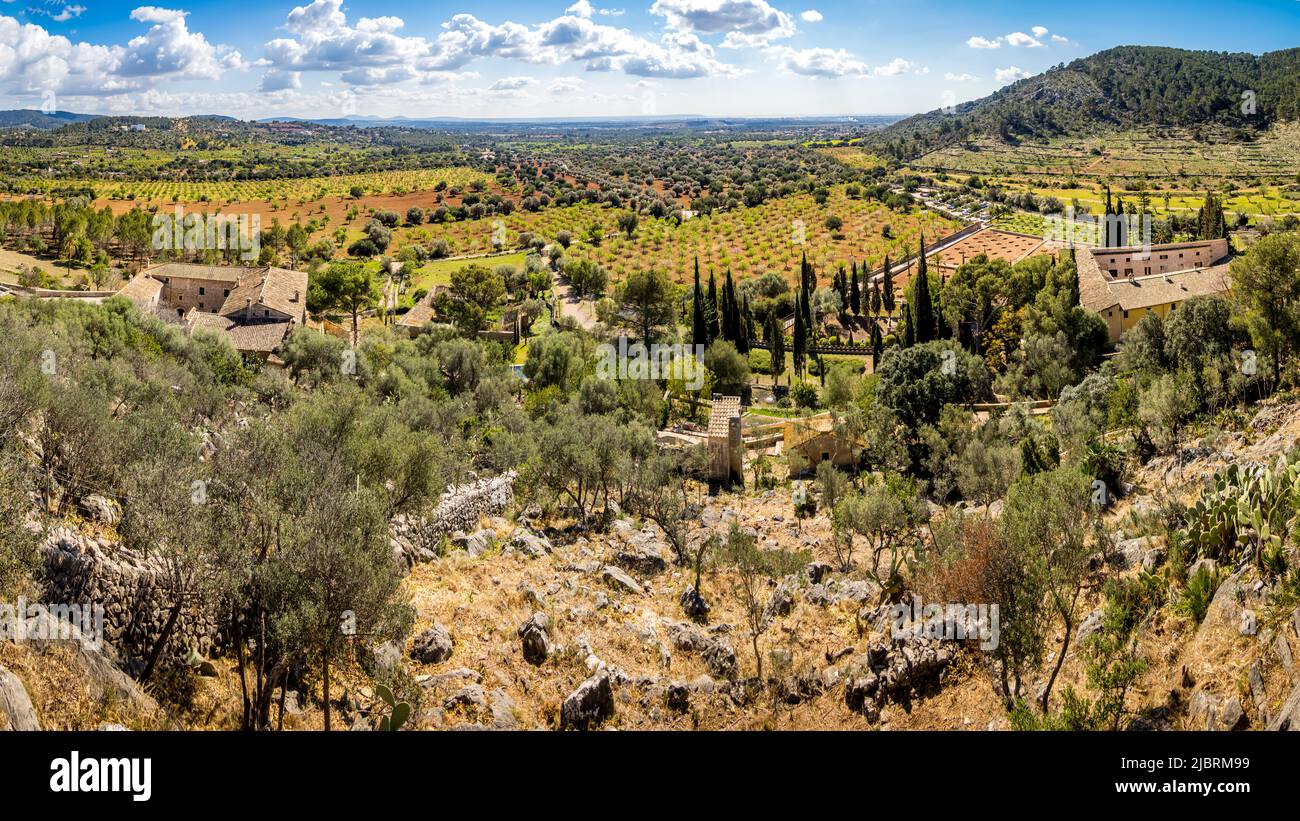 Panoramic view over the lush green grounds of public manor Raixa in the area of Bunyola with almond tree plantations and olive groves. Stock Photo