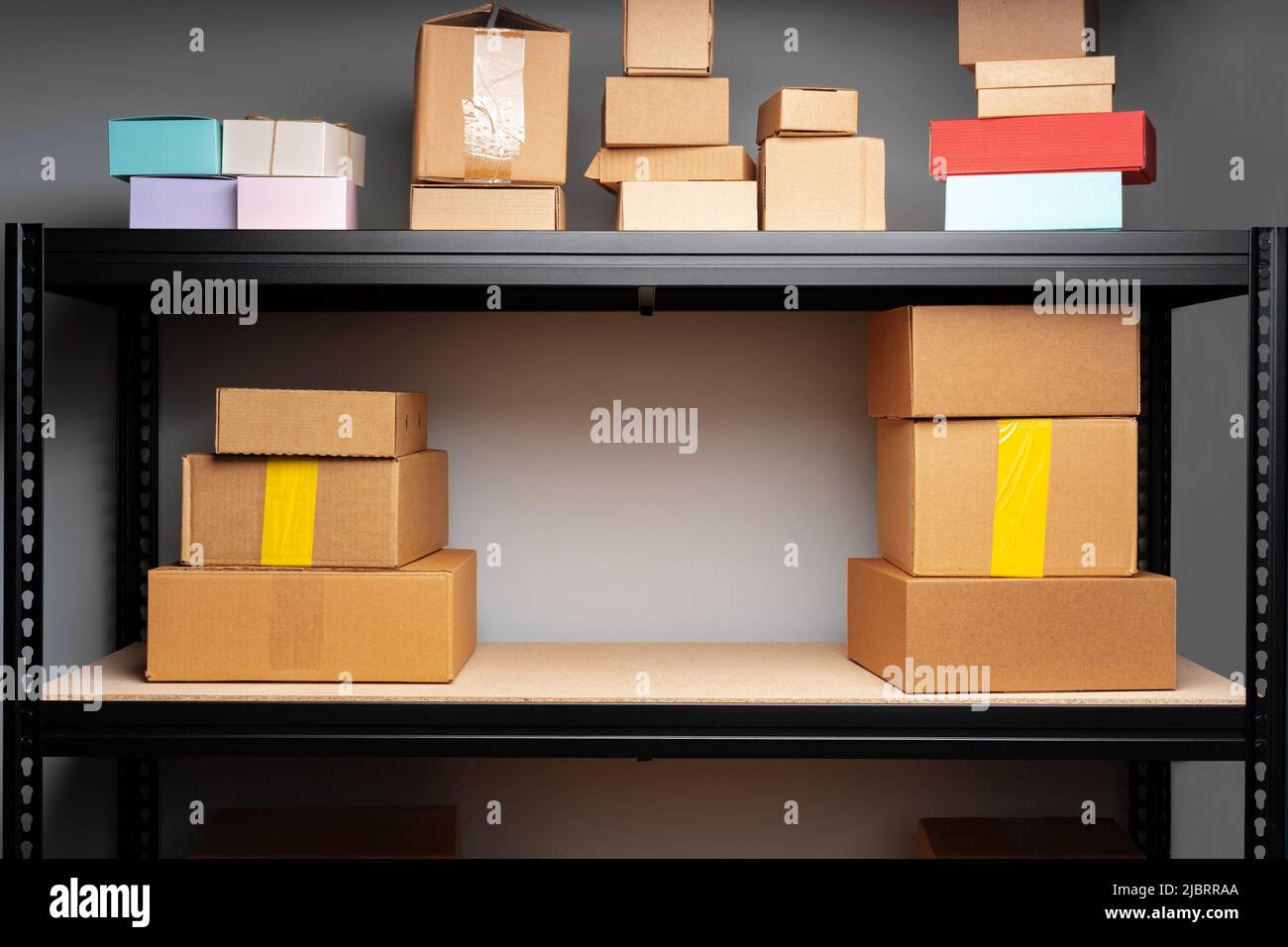 Rows of shelves with cardboard boxes in modern warehouse Stock Photo ...