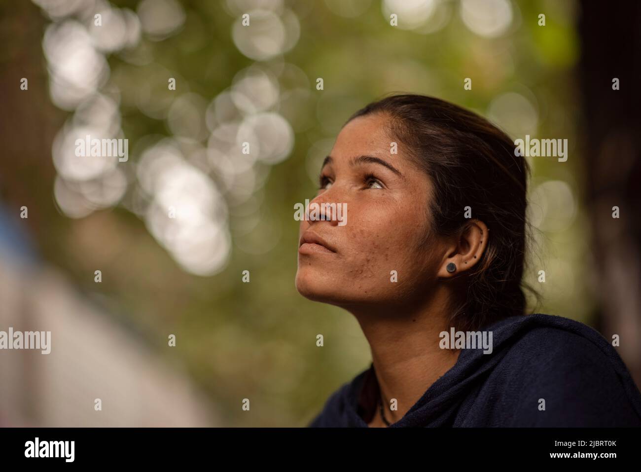 Close-up of a slum young woman thinking Stock Photo