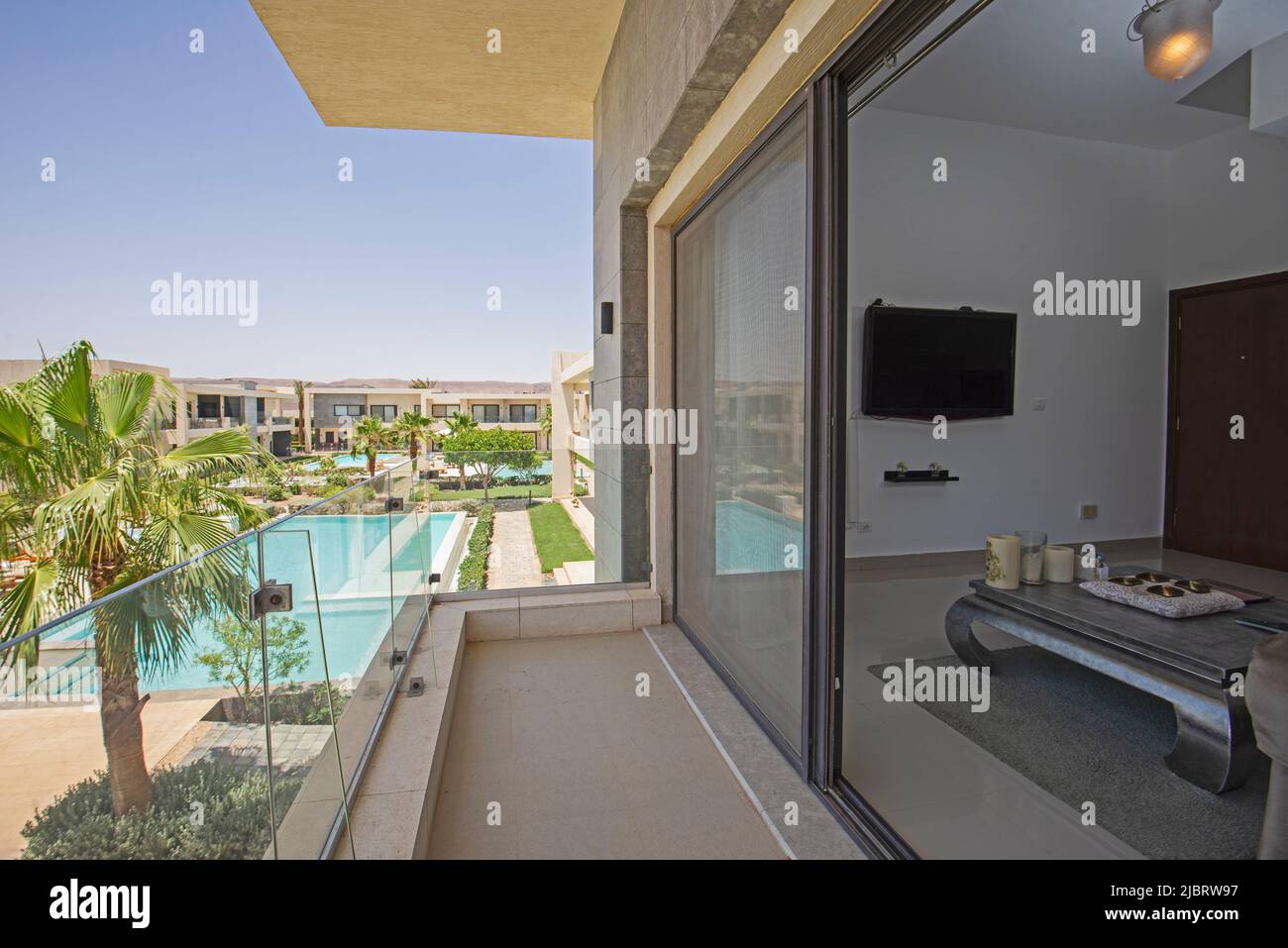 Terrace balcony of a luxury apartment in tropical resort with swimming