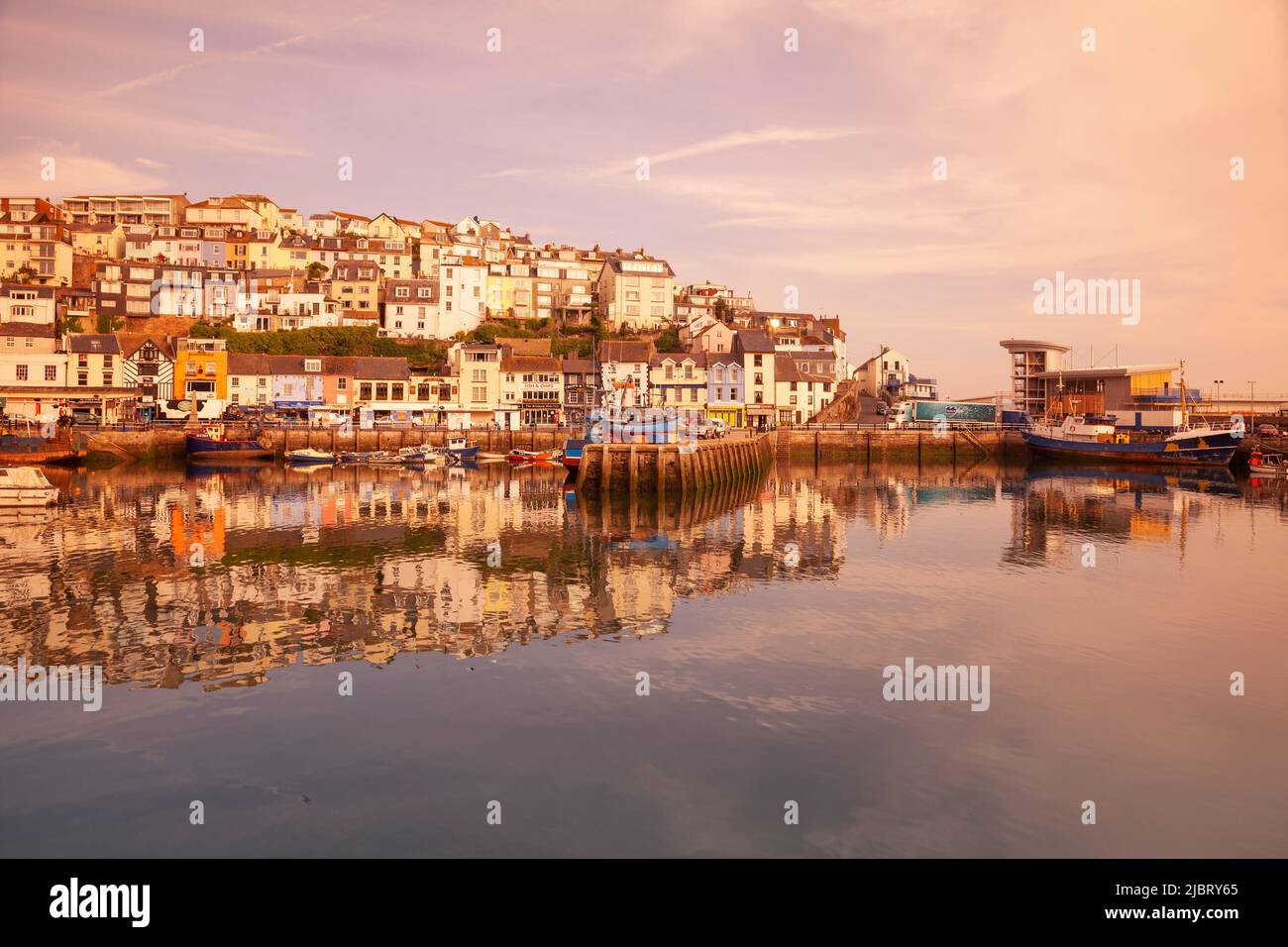 UK, England, Devon, Torbay, Brixham Harbour with The Quay and New Pier at Dawn Stock Photo