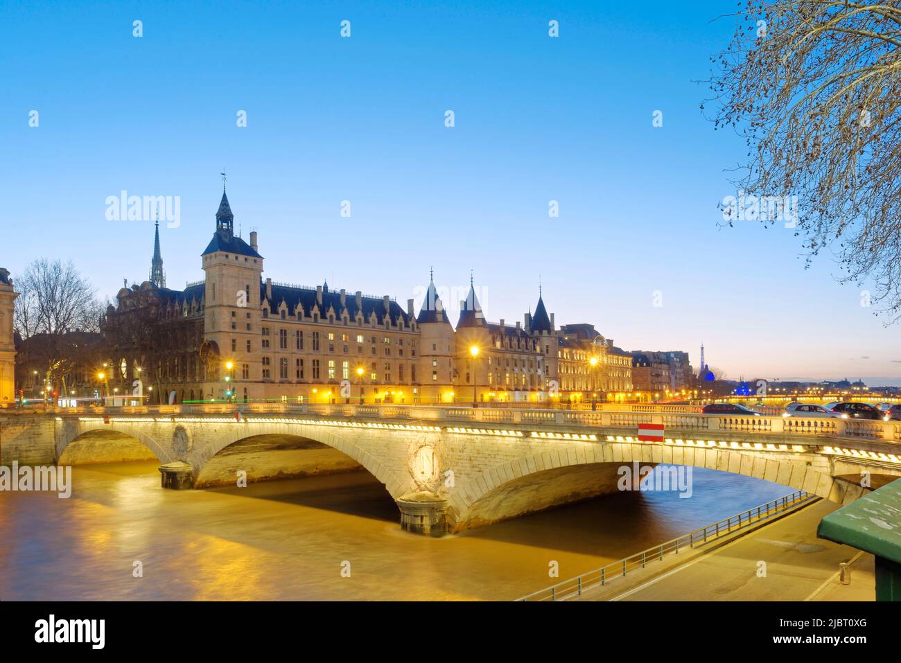 France, Paris, area listed as World Heritage by UNESCO, the Conciergerie on the City island, the pont au Change (Change bridge) in front and the Eiffel tower Stock Photo