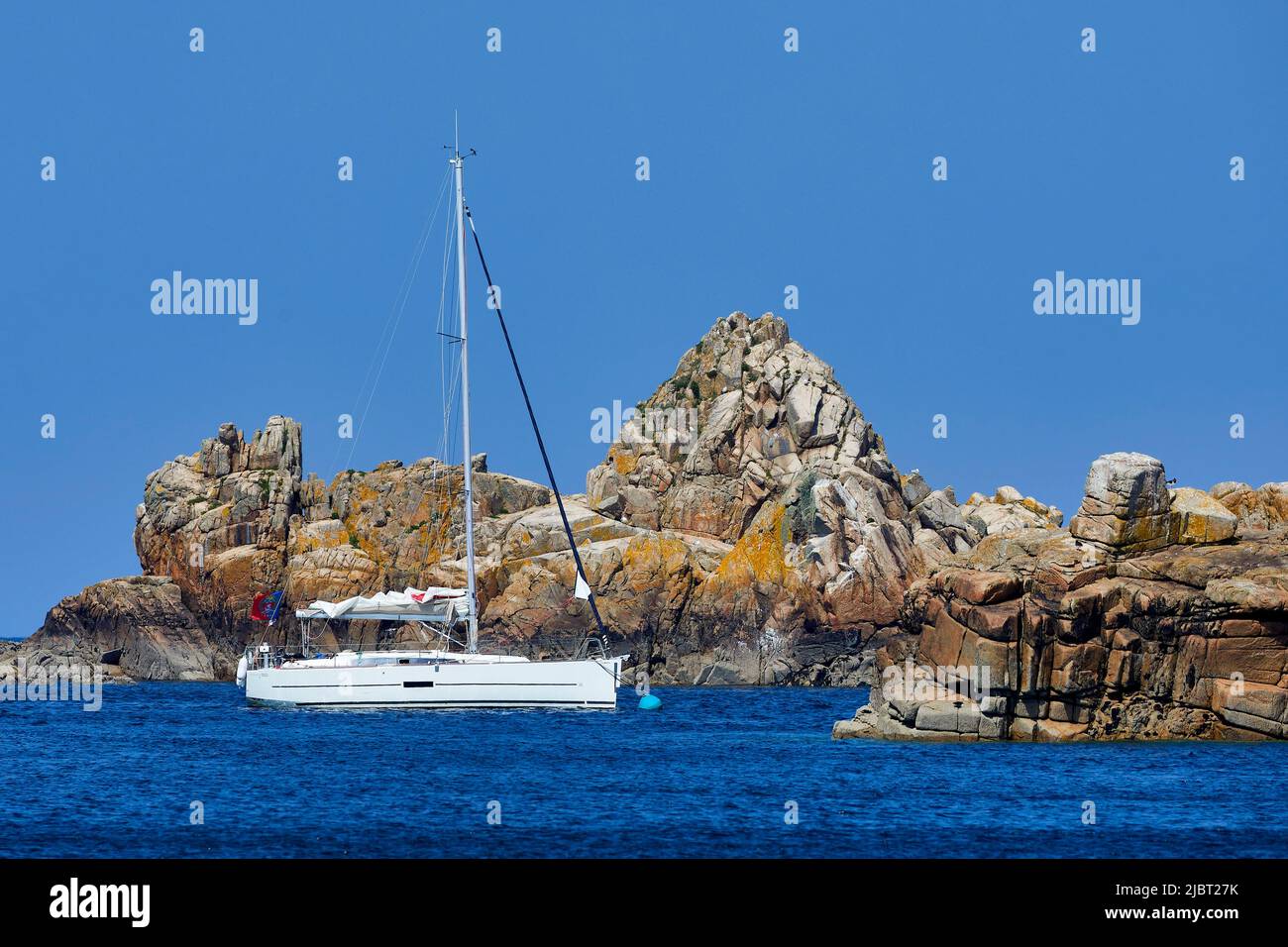 France, Cotes d'Armor, Ile de Bréhat (Brehat island), sailing boat at anchor in front of the Corderie cove Stock Photo