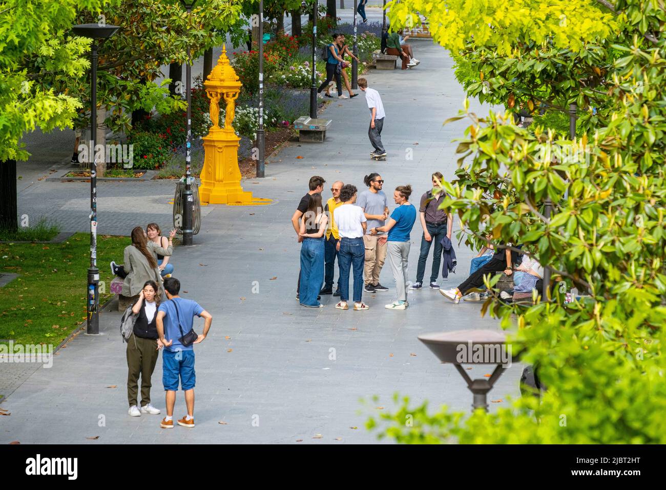 France, Paris, Wallace fountain painted in yellow, Esplanade Pierre