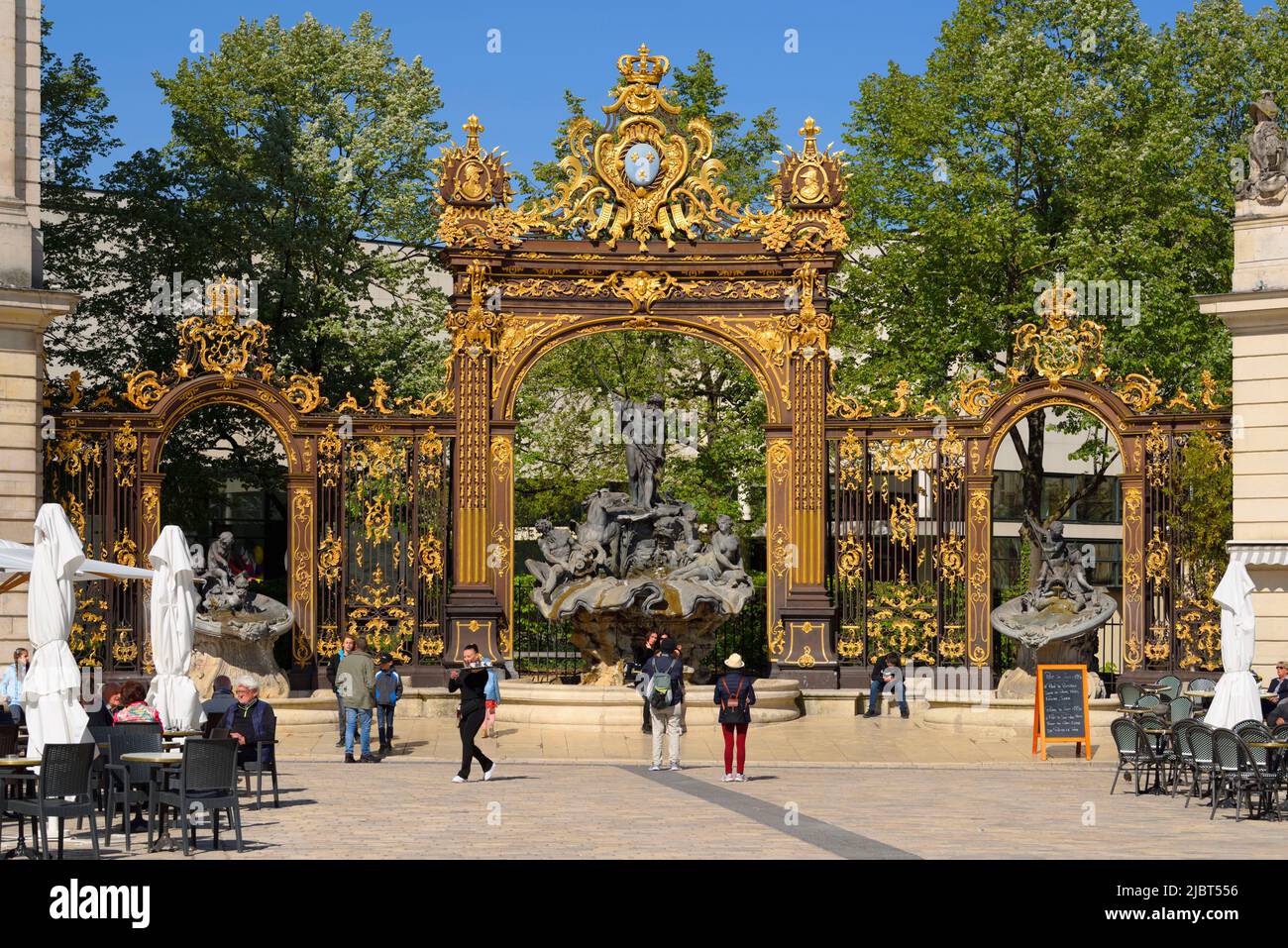 France, Meurthe et Moselle, Nancy, Place Stanislas (former Place Royale) built by Stanislas Leszczynski, King of Poland and last Duke of Lorraine in the eighteenth century, listed as World Heritage by UNESCO, Neptune fountain designed by Guibal and gates enhanced with gold of Jean Lamour Stock Photo
