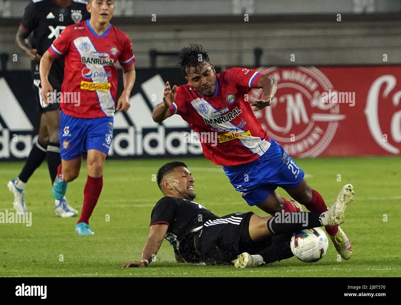 WASHINGTON, DC, USA - 07 JUNE 2022: DC United defender Antonio Alfaro (93) slides into Xelaju forward Esnaydi Zuńiga (21) during a Capital Cup match between D.C United (USA) and Xelaju (GUA) on June 07 2022, at Audi Field, in Washington, DC. (Photo by Tony Quinn-Alamy Live News) Stock Photo