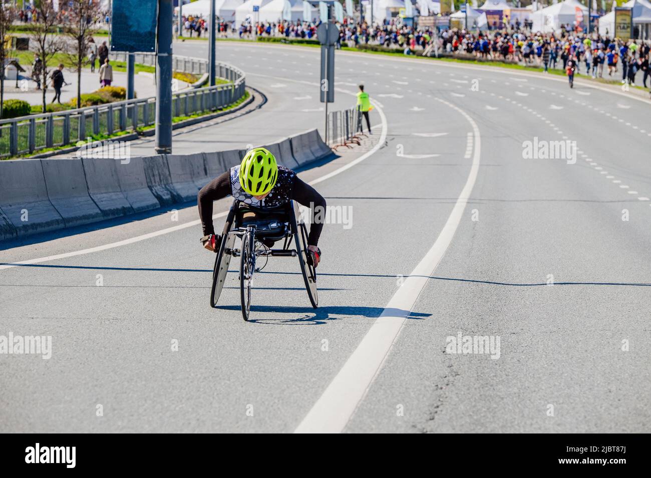wheelchair athlete participant of marathon race Stock Photo