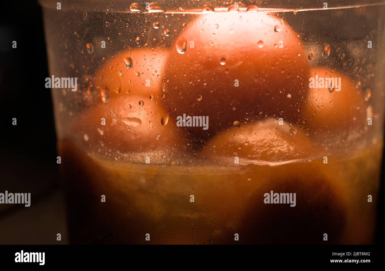 midnight craving for indian sweets in fridge or refrigerator Stock Photo