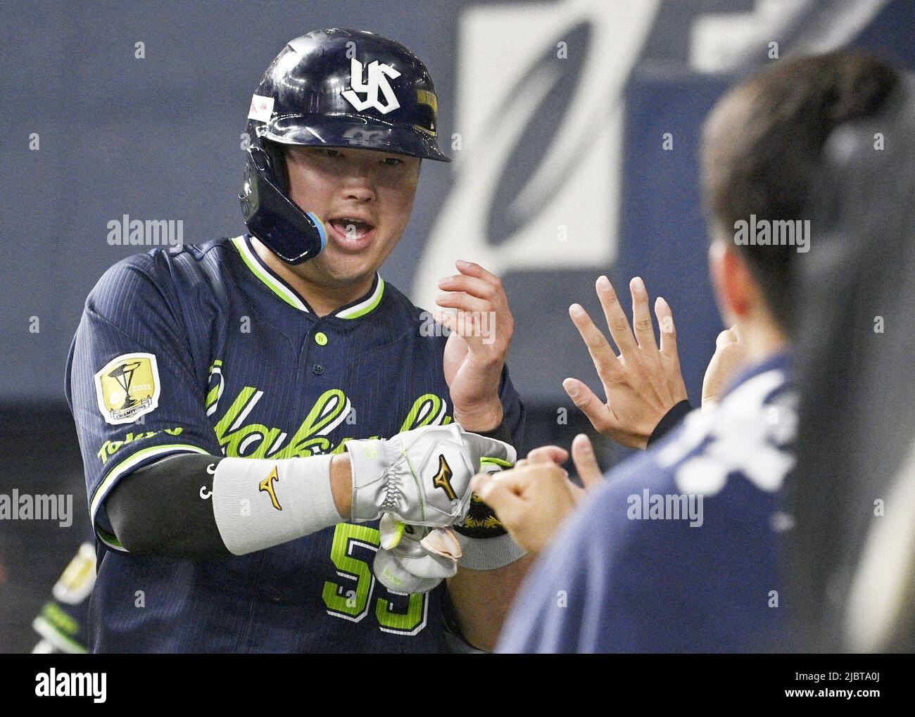 Munetaka Murakami of the Yakult Swallows celebrates with teammates after  scoring on a sacrifice fly by Shingo Kawabata in the eighth inning of an  interleague baseball game against the Orix Buffaloes on
