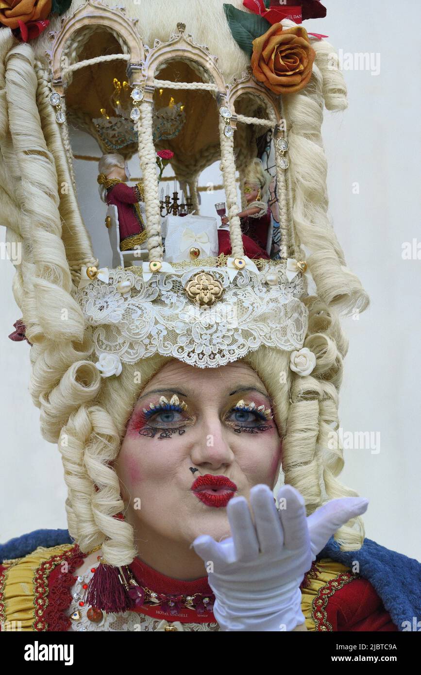 Italy, Venetia, Venice, listed as World Heritage by UNESCO, Venice carnival, Fancy headdress hosting a candllight dinner Stock Photo