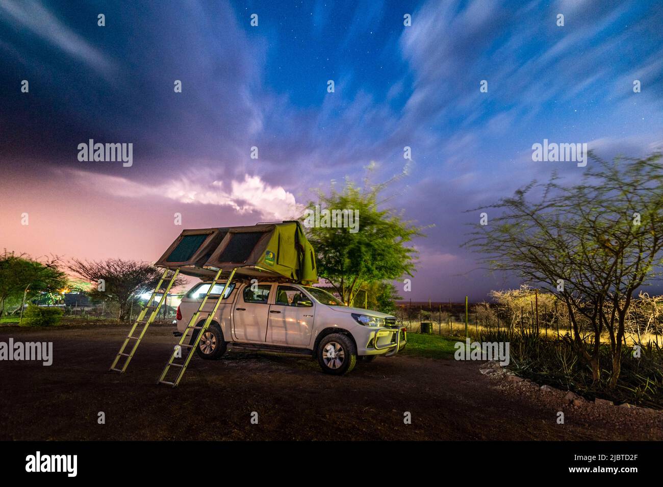 Namibia, Kunene region, Outjo, Etotongwe lodge, 4x4 camp on a stormy night Stock Photo