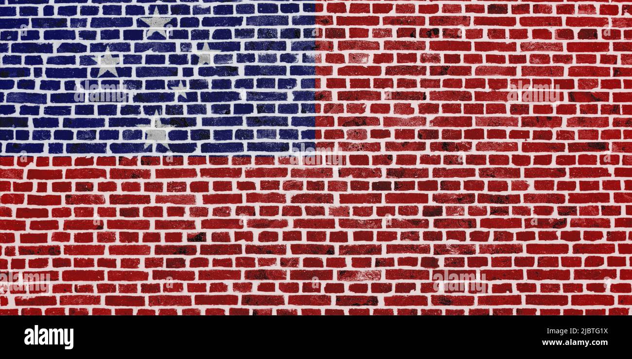 Close-up on a brick wall with the flag of Samoa painted on it. Stock Photo