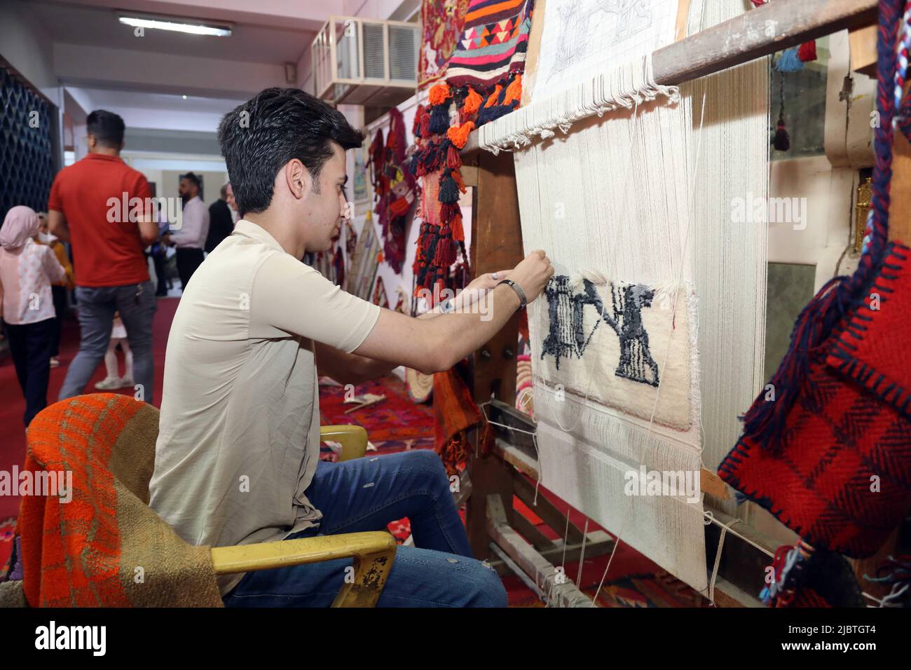 Baghdad, Iraq. 8th June, 2022. An Iraqi craftsman works on a hand-made