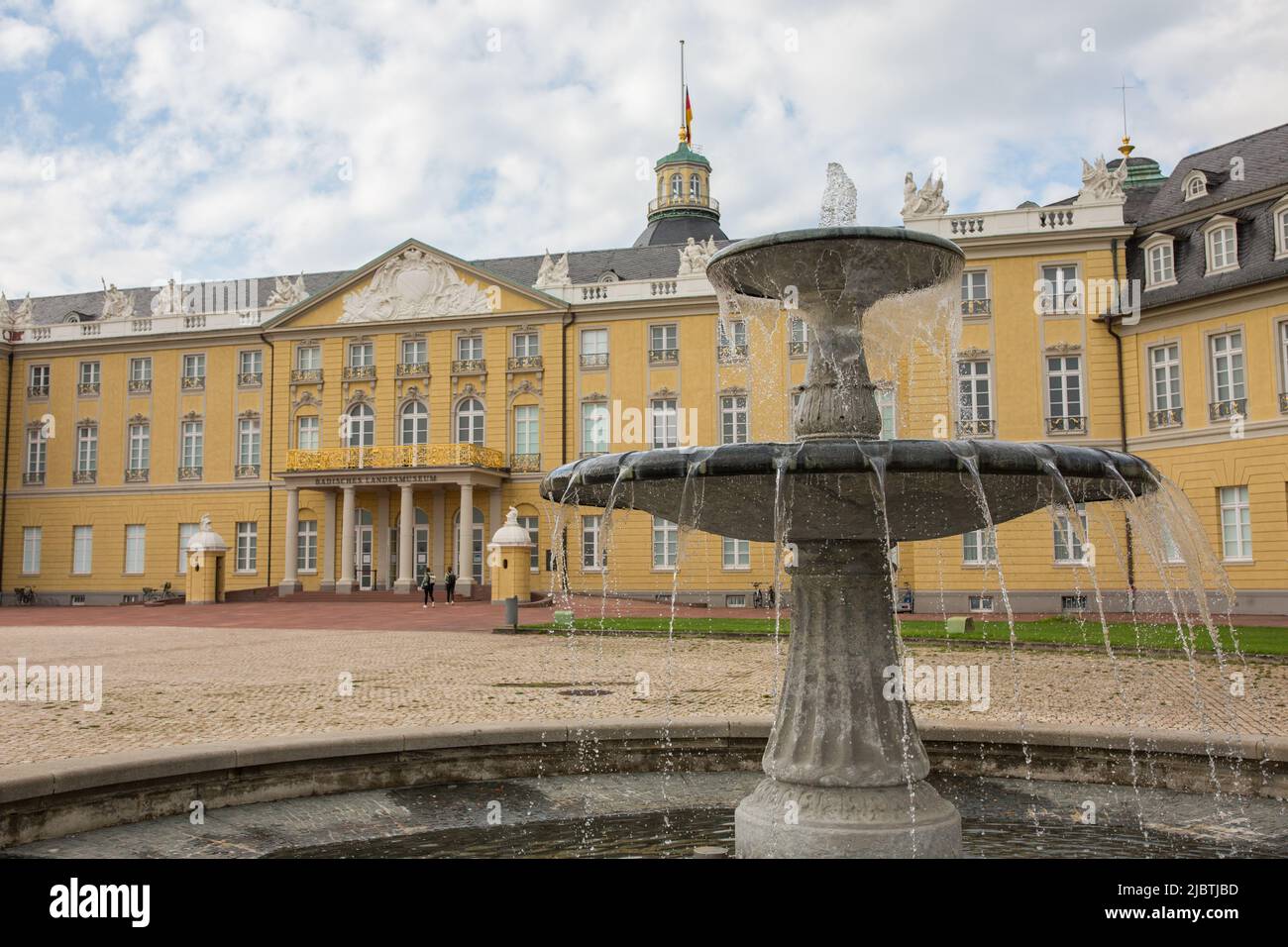 Karlsruhe, Germany - Aug 28, 2021: Fountain in front of Karlsruhe Palace. Stock Photo