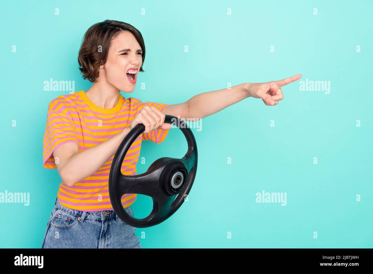 Photo of angry crazy lady wear orange tshirt holding steering wheel