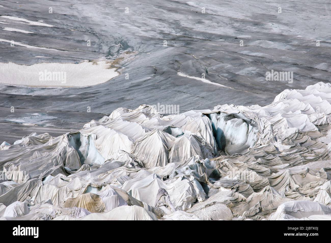 Swiss Rhone glacier cover with blanket protection prevent glacier melting. Save cover against global warming on melting Rhonegletscher in swiss Alps. Stock Photo