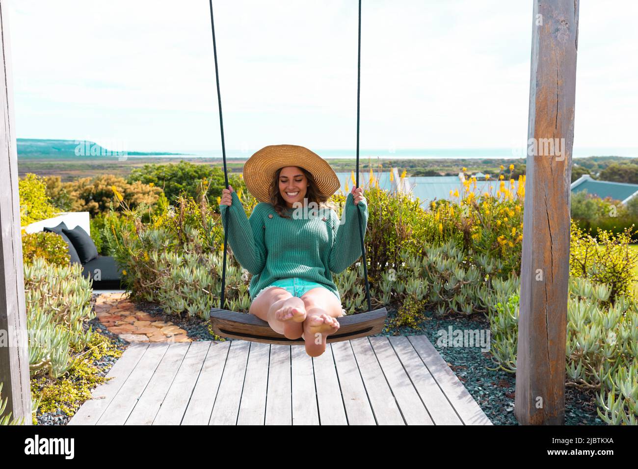 Young woman swinging on swing hi-res stock photography and images - Alamy