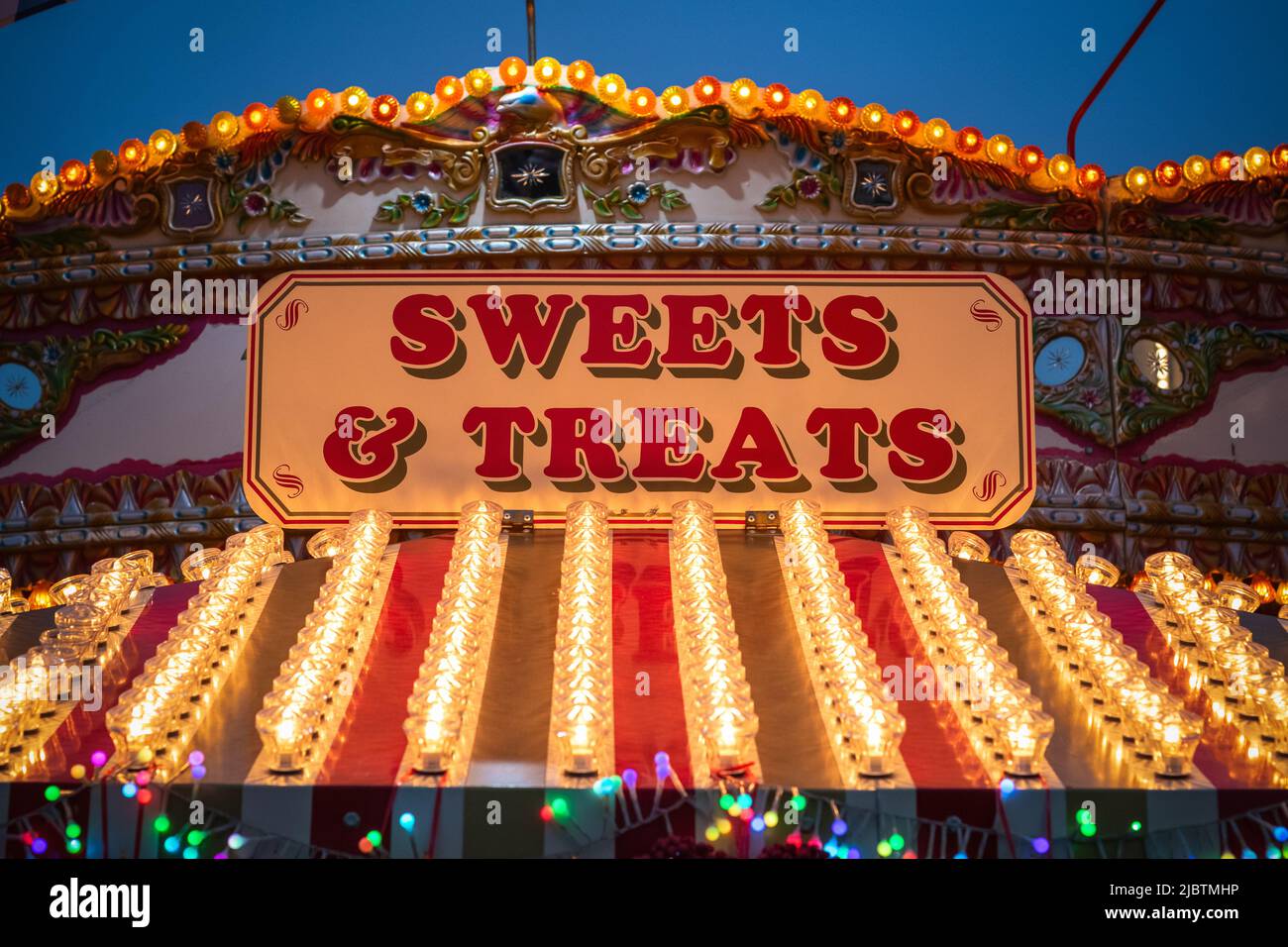 Sign for sweet & treat shop at the Christmas market of Hyde Park Winter Wonderland in London Stock Photo