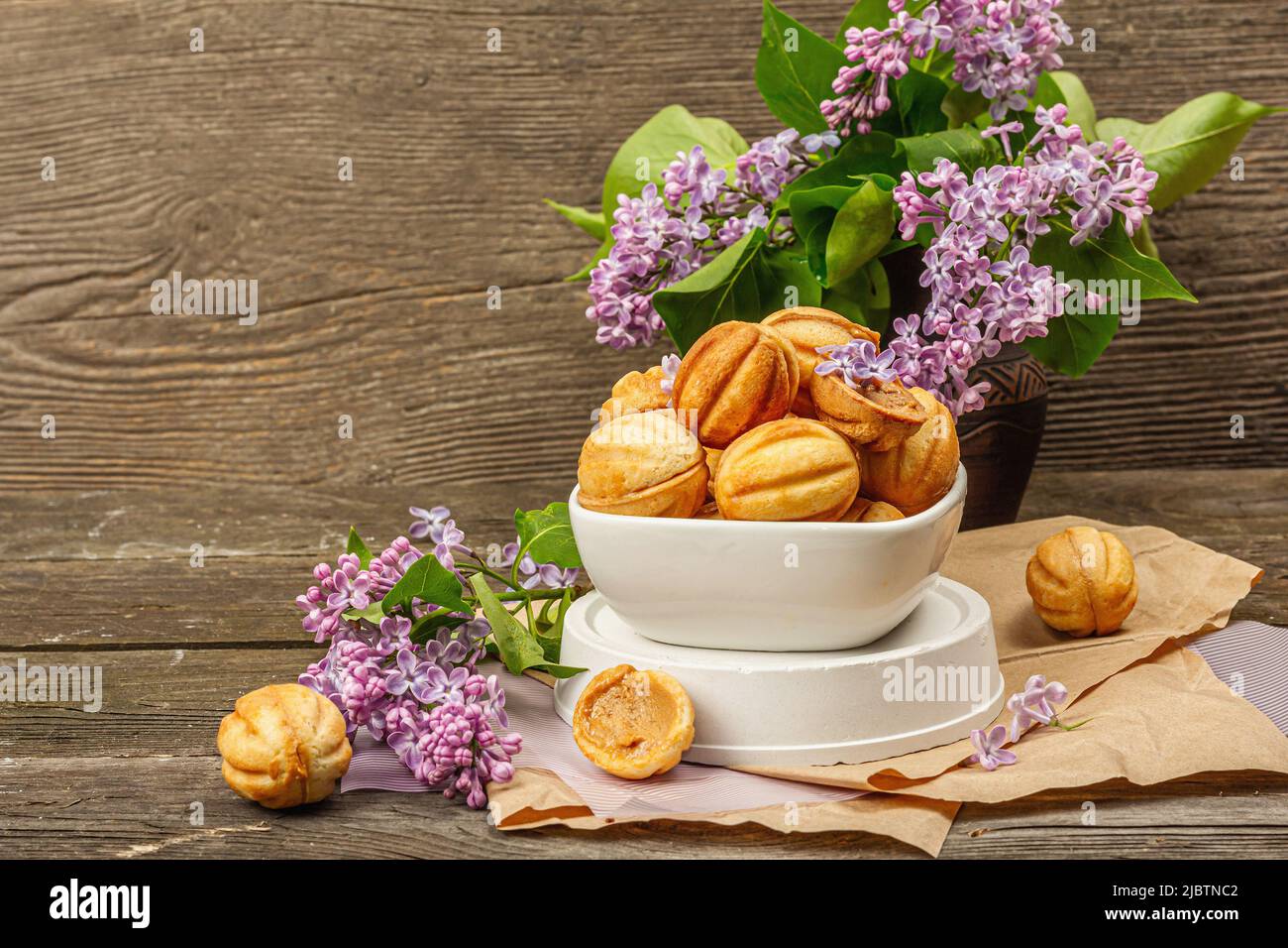 Cookies in the shape of walnuts with condensed milk cream filling