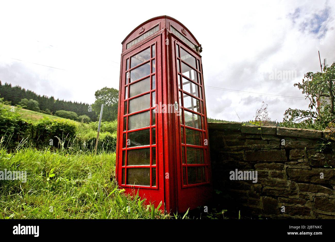 Undated file photo of a a red phone box in Wales. Public payphones in areas with poor mobile signal or high accident rates will be safeguarded from removal. The new rules, which come into force on Wednesday mean that there will be stronger protection for public payphones that are still needed by their local community, Ofcom have said. Issue date: Wednesday June 8, 2022. Stock Photo