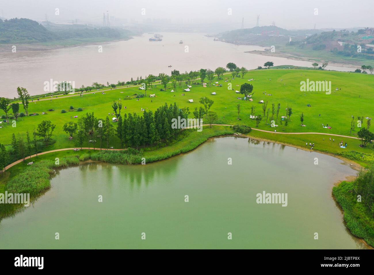 Chongqing. 5th June, 2022. Aerial photo taken on June 5, 2022 shows a view of Guangyang Isle in southwest China's Chongqing. Guangyang Isle, the largest island on the upper Yangtze River, is rich in natural resources. In recent years, a series of measures have been taken to restore the island's ecological environment, attracting tourists to its colorful fields. Credit: Wang Quanchao/Xinhua/Alamy Live News Stock Photo