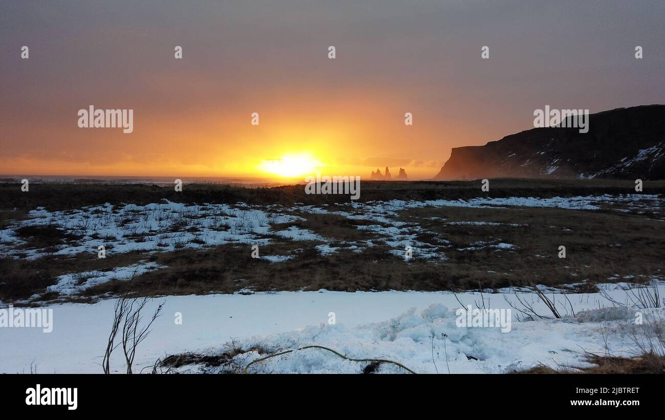 Snowy path in the mountains of Iceland at sunset. Stock Photo