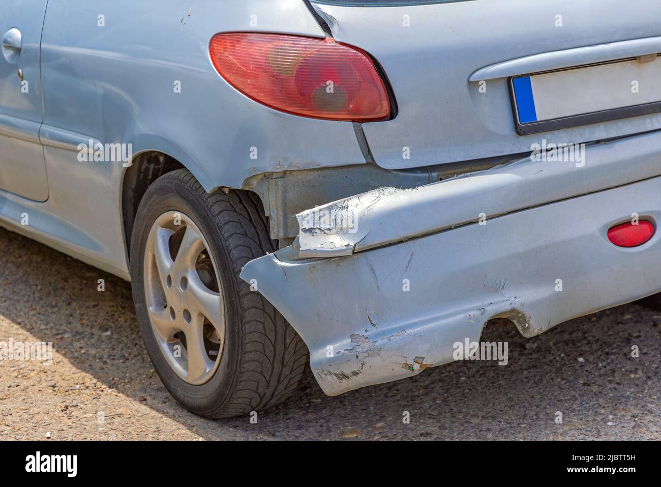 Hanging Rear Bumper Off at Small Car Damage Accident Stock Photo