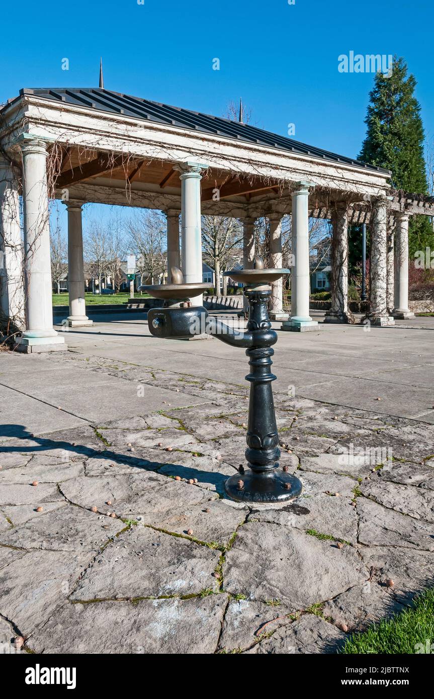 Drinking water fountain in Central Park with classical gazebo in