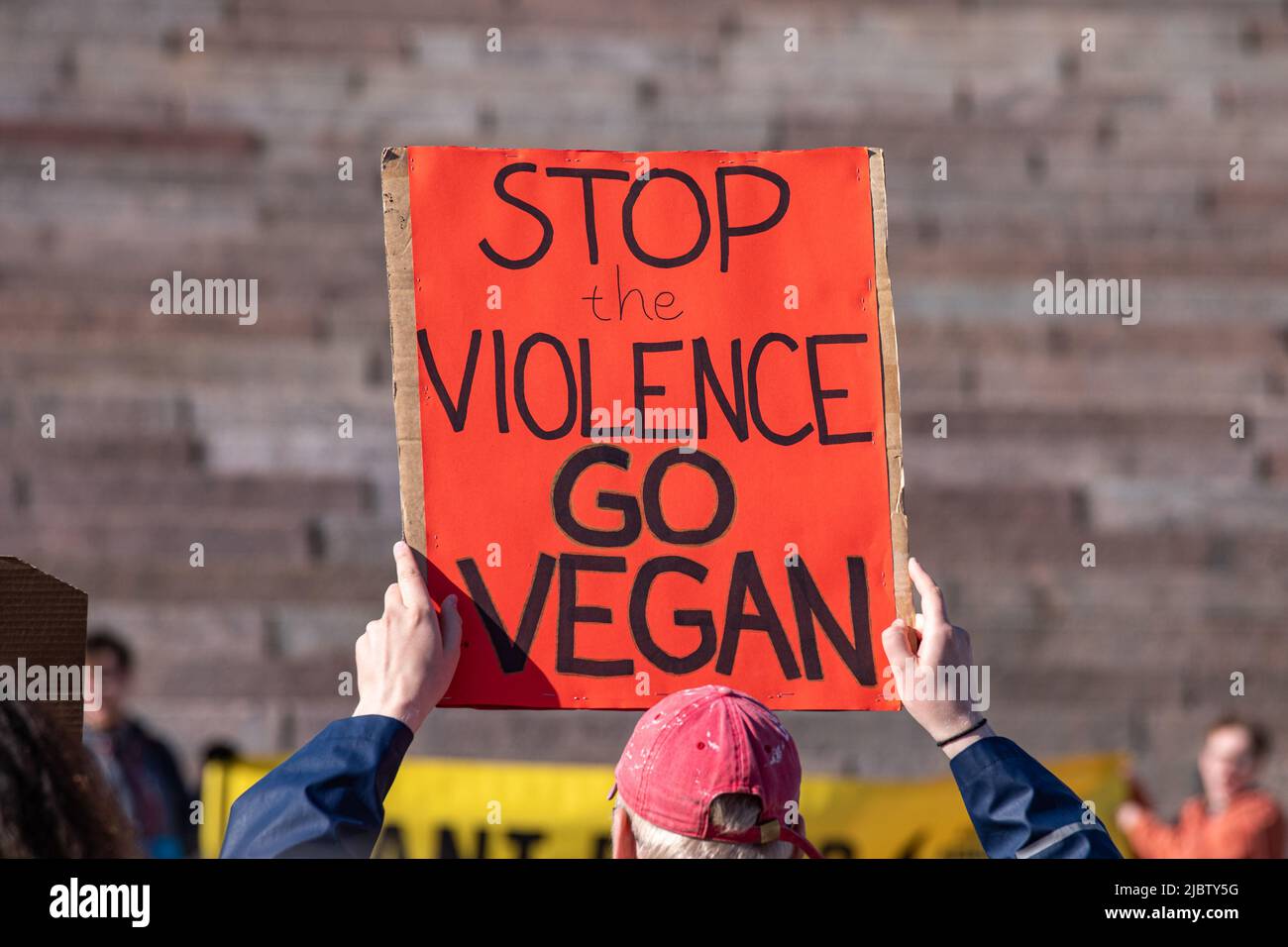 Stop the violence - go vegan. Man holding a hand-written sign at Elokapina or Extinction Rebellion Finland Eläinkapina demonstration in Helsinki Stock Photo