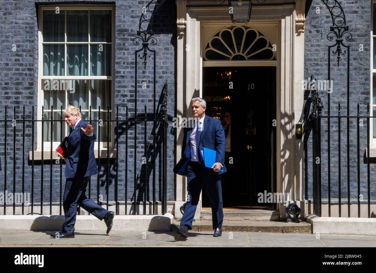 London, UK. 8th June, 2022. Prime Minister of the United Kingdom, Boris Johnson, leaves Number 10 in Downing Street with his Chief of Staff and Chancellor of the Duchy of Lancaster, Stephen Barclay. He heads to the House of Commons for Prime Ministers Questions. He faces interrogation by Sir keir Starmer over the recent Vote of No confidence in whiuch 148 of his own party members, voted against him. This is 41% of his own Party. Credit: Karl Black/Alamy Live News Stock Photo