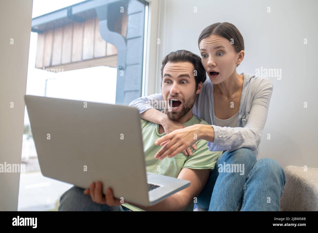 Surprised happy millennial man hi-res stock photography and images - Alamy