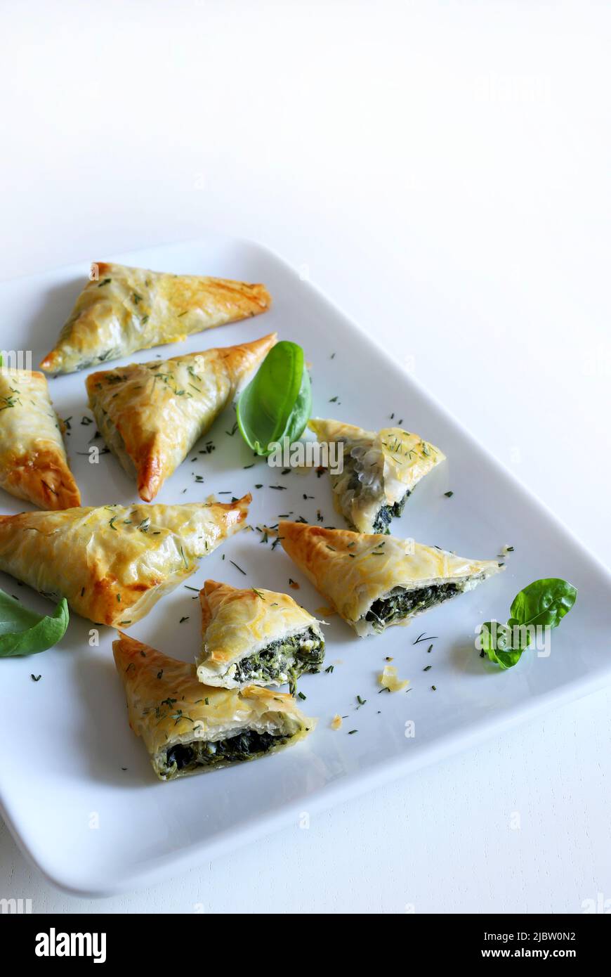 Greek food. Spanakopita, phyllo pastry triangle with spinach and feta