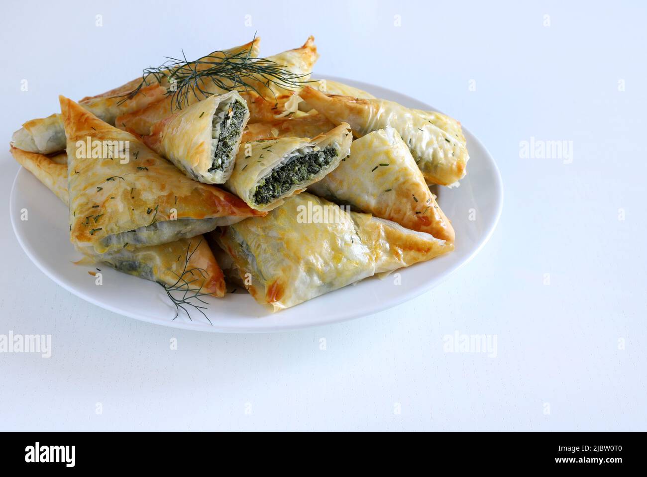 Greek food. Spanakopita, phyllo pastry triangle with spinach and feta