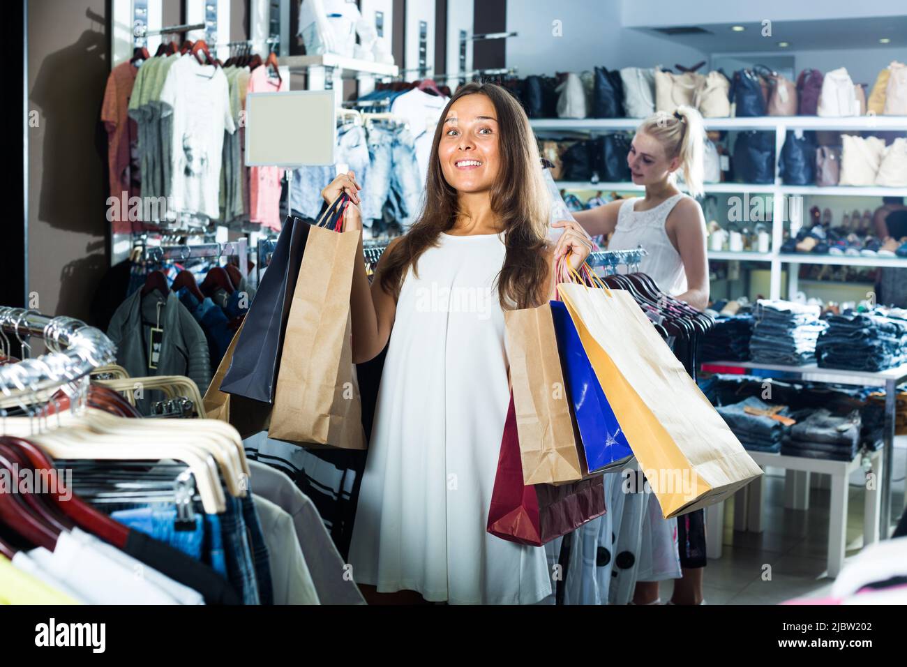 woman carrying many paper bags Stock Photo