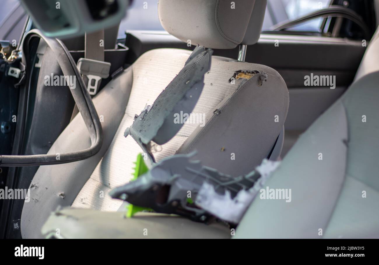 The interior of the car is damaged after the accident, broken glass on