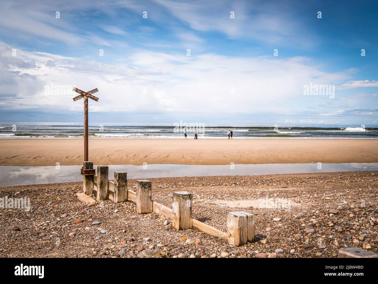 A sunny summer HDR image of sea defences,Groynes, on Findhorn Beach, Moray, Scotland. 30 May 2022 Stock Photo