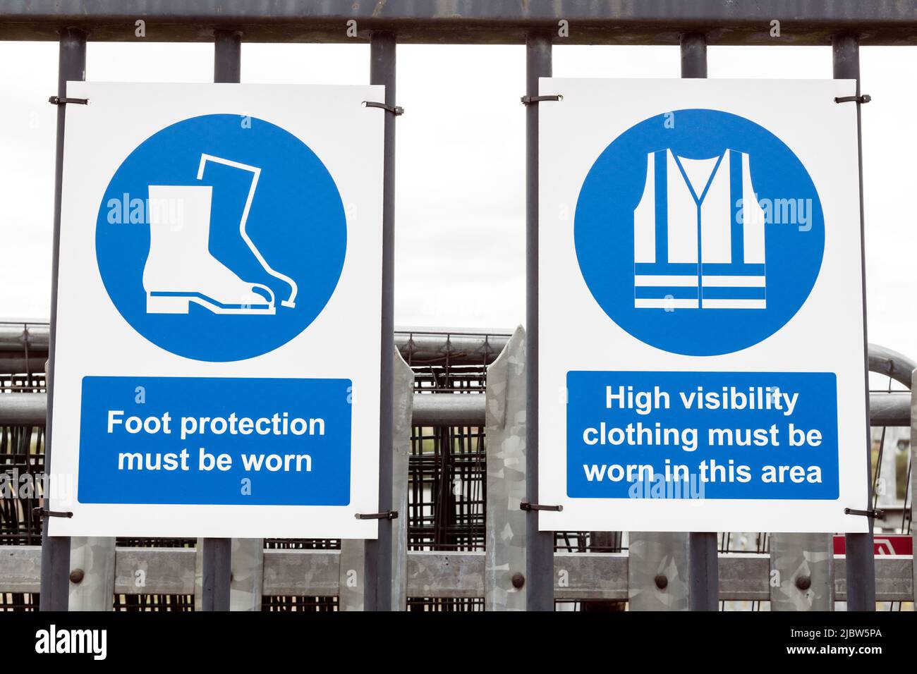 Foot Protection and High Visibility Clothing Must Be Worn In This Area Health And Safety Notices at the entrance to a workplace, UK Stock Photo