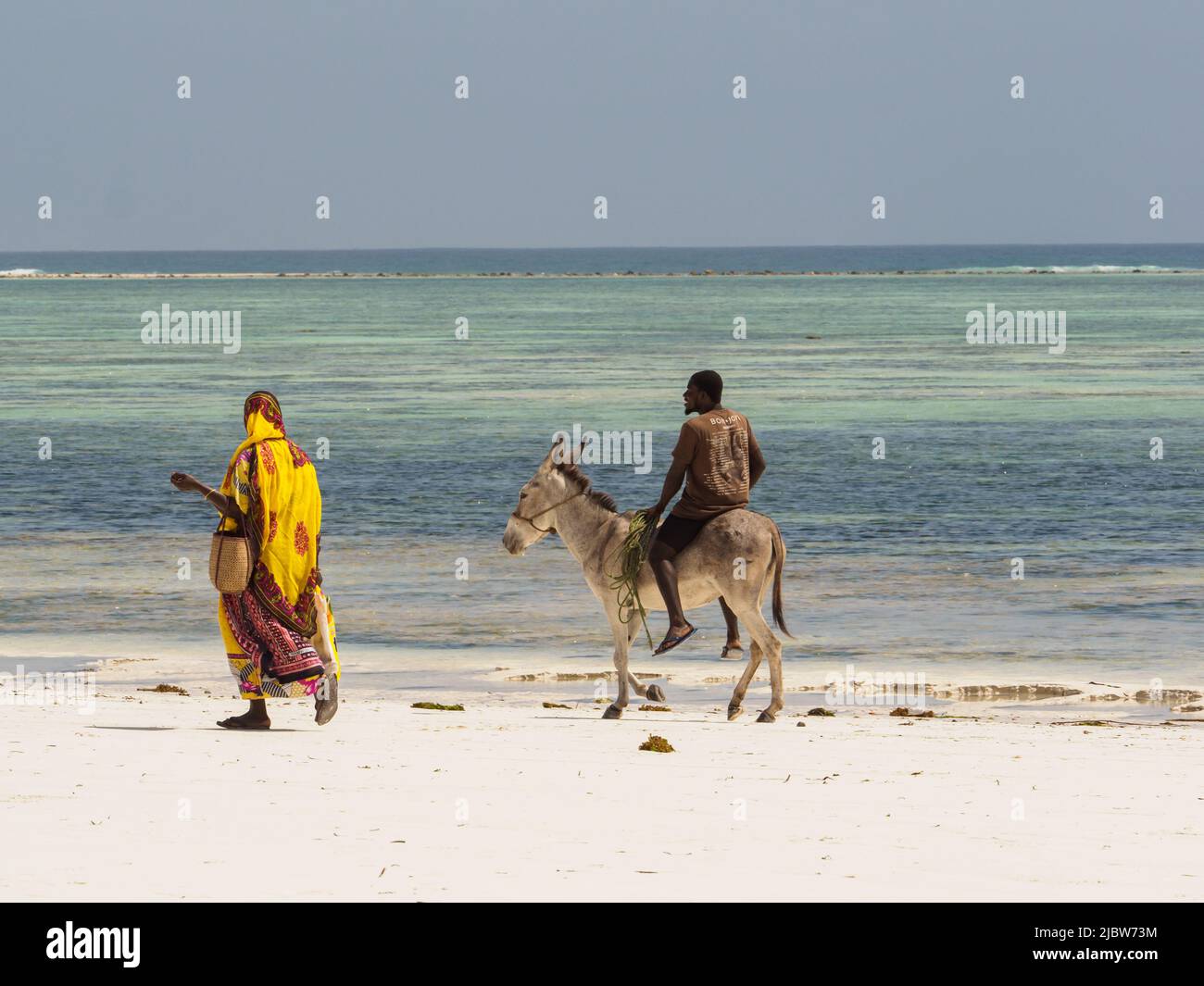 Matemwe, Zanzibar - Jan, 2021: The daily life of local people on a Zanzibar sandy beach. Tanzania, Africa Stock Photo