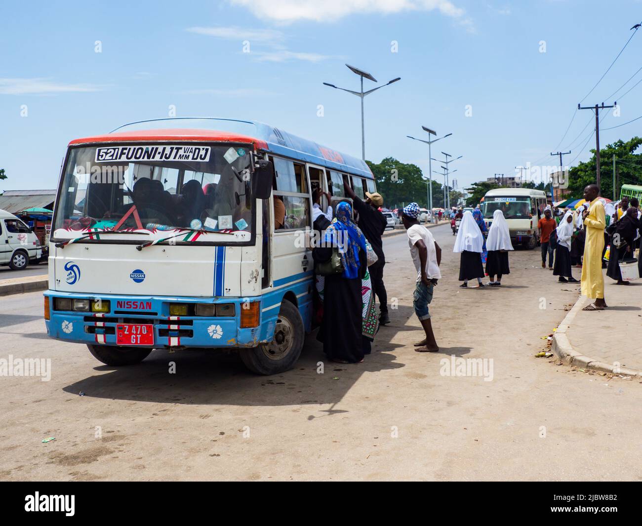 Zanzibar, Tanzania - January 2021: Buses on the street of Africa - public transport transporting people and goods. Covid in Africa Stock - Alamy