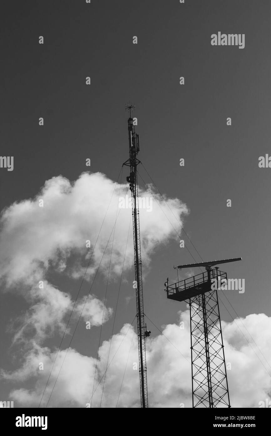 Up view. Tower with TV, radio, internet antennas. Providing modern communications. Stock Photo