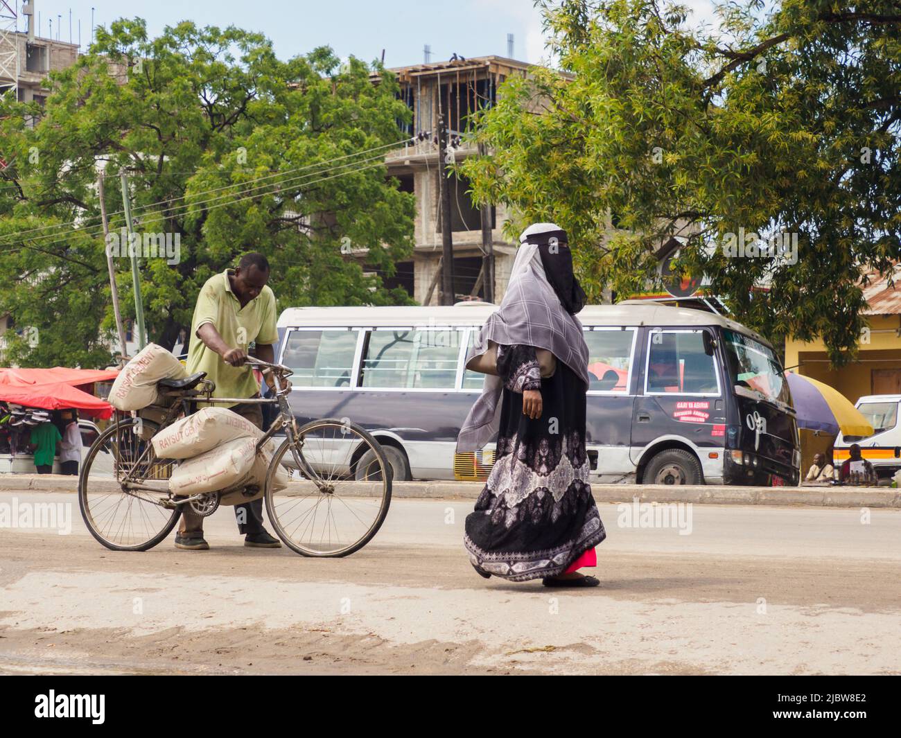 Zanzibar, Tanzania - Feb, 2021: The bicycle is a very popular means of transport in Africa, both for transporting people and various types of goods.. Stock Photo